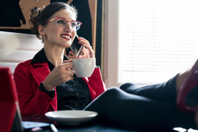 Young woman drinking coffee