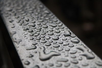 Close-up of raindrops on metal