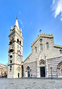 Low angle view of historical building against blue sky