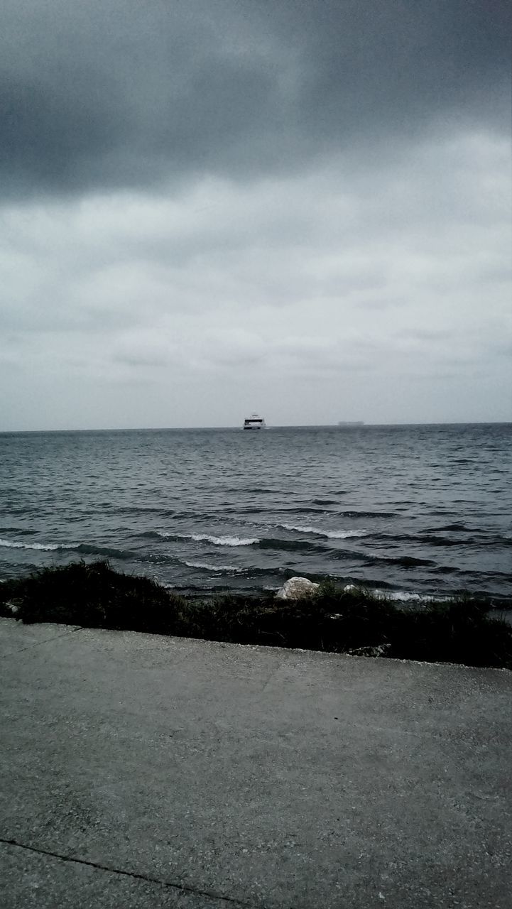 sea, horizon over water, water, sky, tranquil scene, tranquility, scenics, beauty in nature, cloud - sky, nature, transportation, nautical vessel, cloudy, cloud, waterfront, seascape, rippled, boat, idyllic, mode of transport