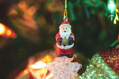 Santa claus doll hanging isolated on christmas decoration tree