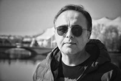 Portrait of man wearing sunglasses against sky