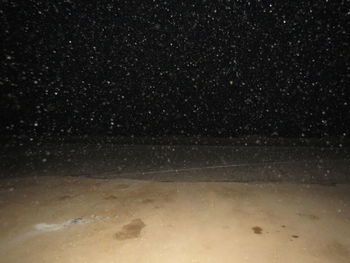 Scenic view of star field against sky at night