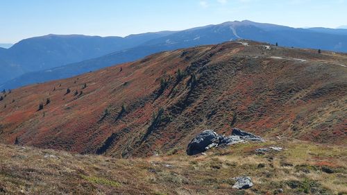 Scenic view of landscape and mountains against sky