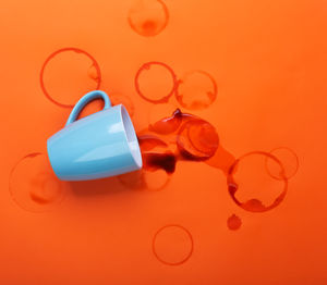 Close-up of bubbles against orange background