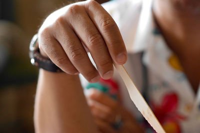 Cropped hand of person painting