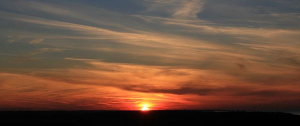 Scenic view of dramatic sky during sunset