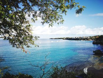 Scenic view of sea against blue sky