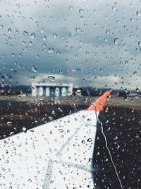 City seen through wet glass window