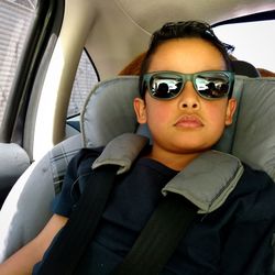 Portrait of boy sitting in car