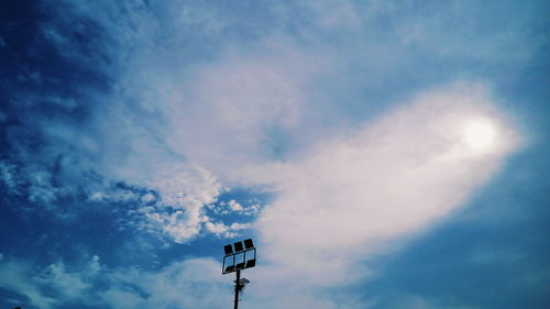 Low angle view of floodlight against sky