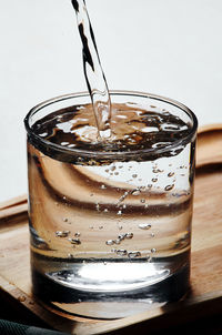 Close-up of beer glass on table