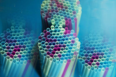 A set of cocktail tubes on a blue background. view from the end. close-up. abstract background. 