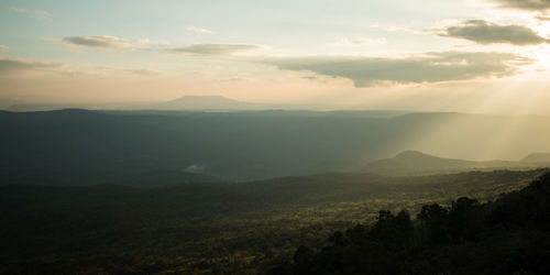 Scenic view of mountains against sky at sunset