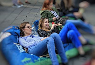 Young woman sitting on floor