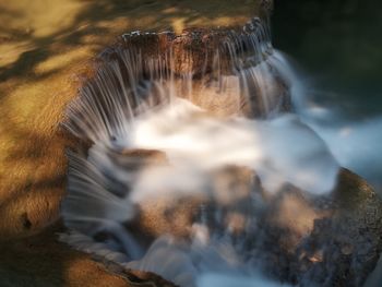 Close-up of water flowing through rocks