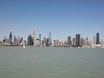 City skyline against blue sky