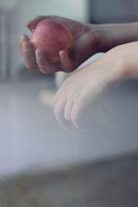 Close-up of hand holding ice cream