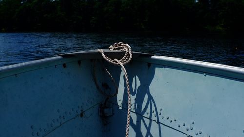Close-up of rope tied on boat sailing in sea