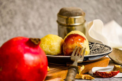 Close-up of fruits in basket on table