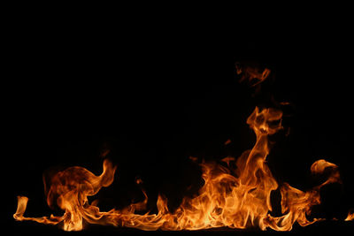 Close-up of fire against black background