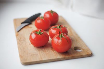 Close-up of tomatoes on cutting board