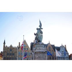 Low angle view of statue in town