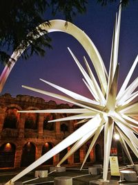 Low angle view of illuminated built structure against sky