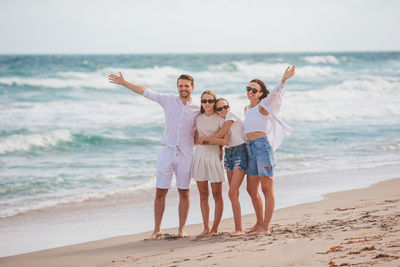 Full length of girl standing at beach