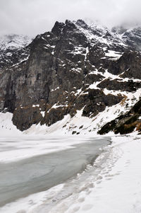 Scenic view of snow covered mountains