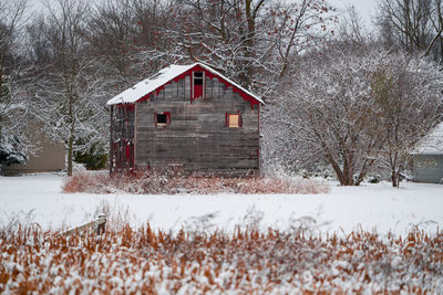 House on snow covered field