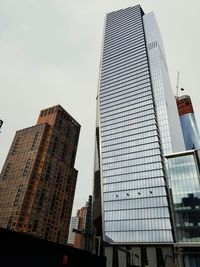 Low angle view of modern buildings against sky