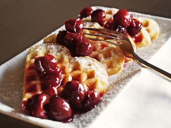 Close-up of fruits on waffle in tray