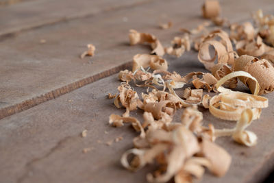 Close-up of wood shavings on table