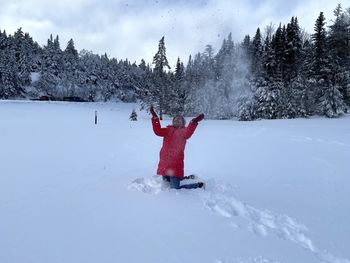 Person standing on snow covered field