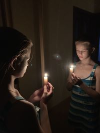 Friends enjoying in illuminated room