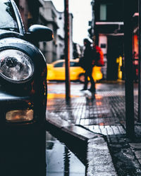 Reflection of man on wet street