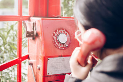 Close-up of woman talking over telephone