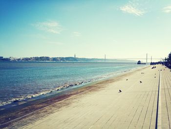 Scenic view of sea against blue sky