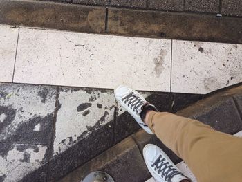 Low section of man standing on floor