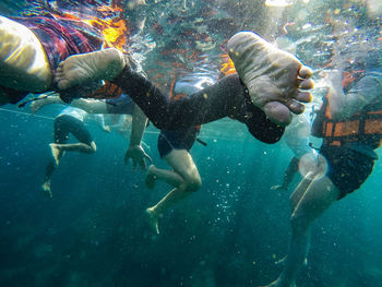 People swimming in sea