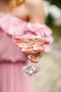 Close-up of hand holding glass of wine