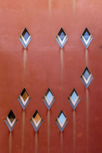 Close-up of air ducts on red wall