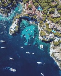 High angle view of boats in sea by town