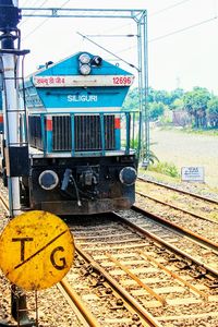 Train on railroad track against sky