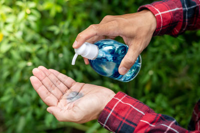 Close-up of hand holding plant