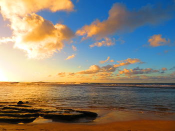 Scenic view of sea against sky at sunset