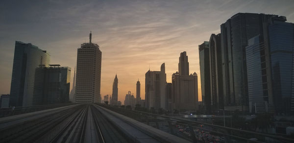 View of buildings in city at sunset in dubai