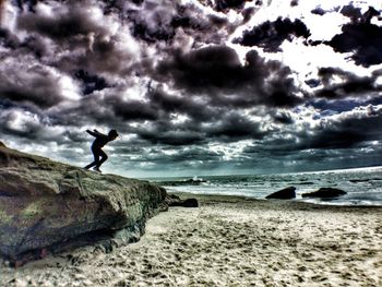 Scenic view of sea against cloudy sky