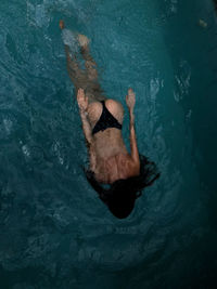 High angle view of woman swimming in pool